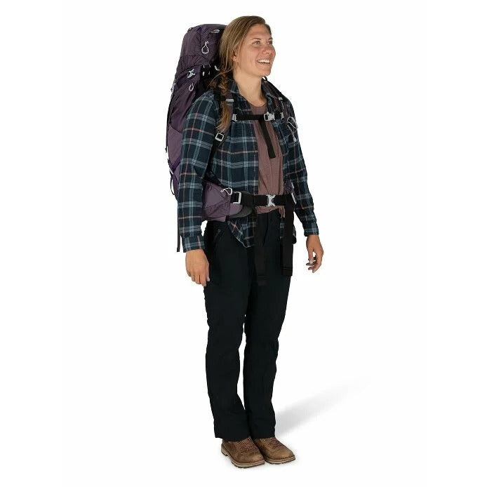Person wearing a large backpack on a white background