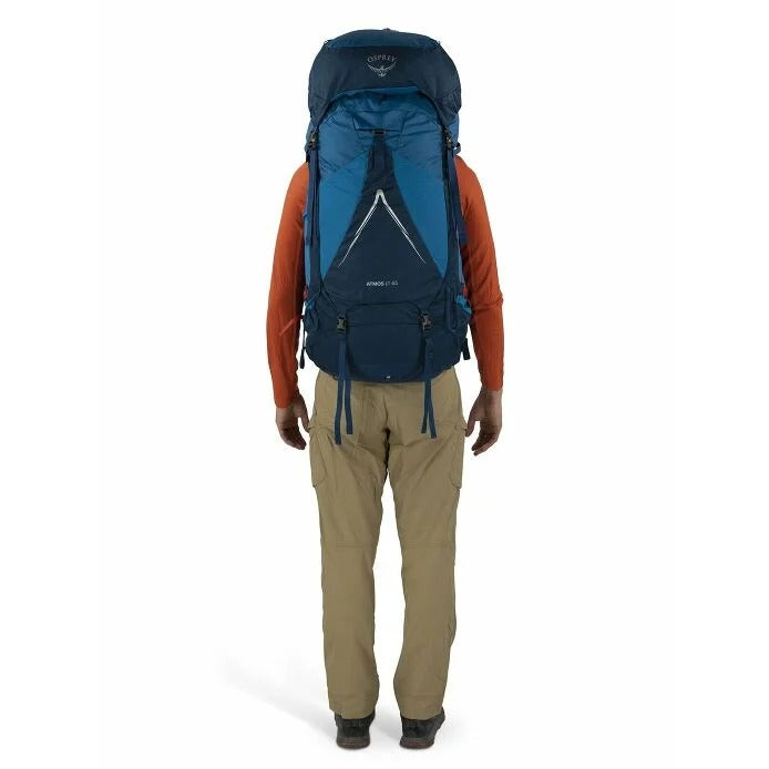 Person wearing a blue Osprey backpack on a white background