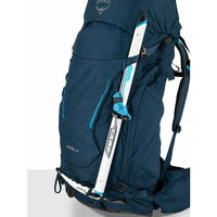Blue Osprey hiking backpack with ski attached on a white background