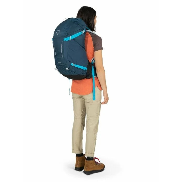 Person wearing a blue backpack on a white background