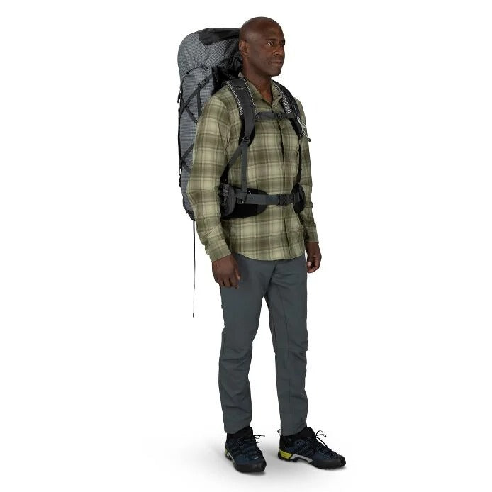 Man wearing a hiking backpack on a white background