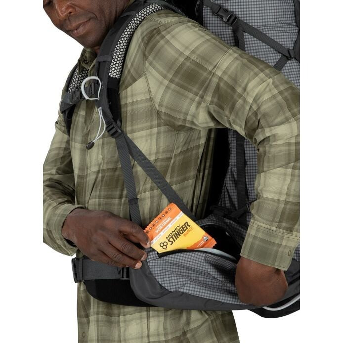 Person wearing a backpack with a St. Lawrence brand item attached.