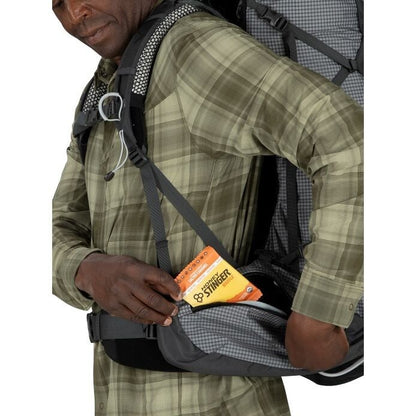 Person wearing a backpack with a St. Lawrence brand item attached.