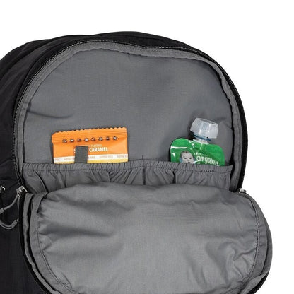 Gray backpack with a small compartment containing a caramel candy bar and a green bottle.