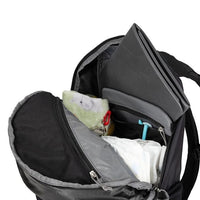 Black backpack with items inside on a white background