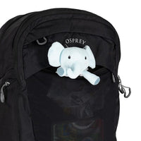 Black Osprey backpack with a plush elephant toy peeking out