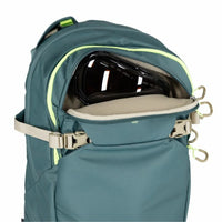Teal backpack with a helmet inside on a white background
