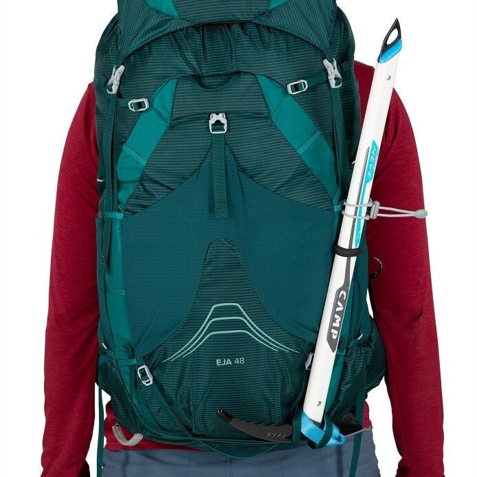 Person wearing a green backpack with a ski attached, on a white background