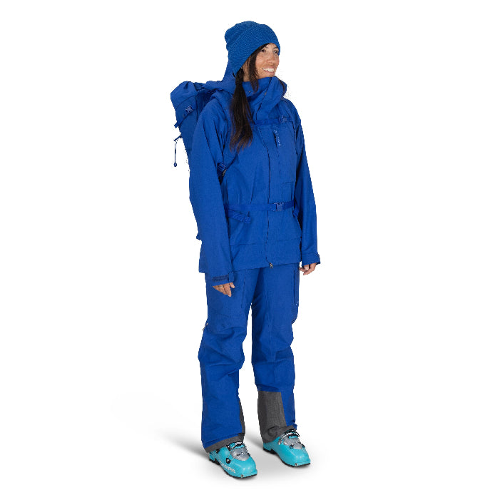 Person wearing a blue rain suit and hat on a white background