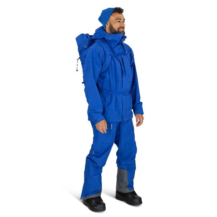 Person wearing a blue snowsuit on a white background