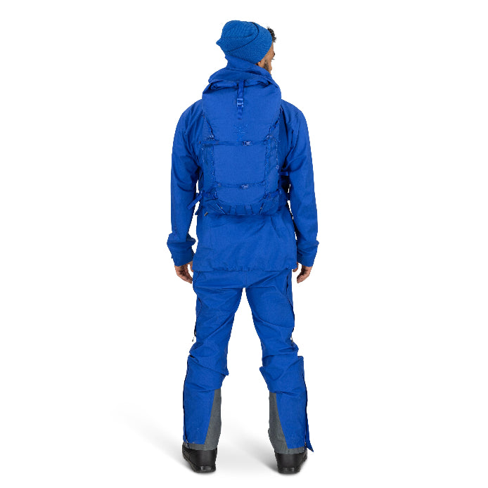 Person wearing a blue snowsuit on a white background