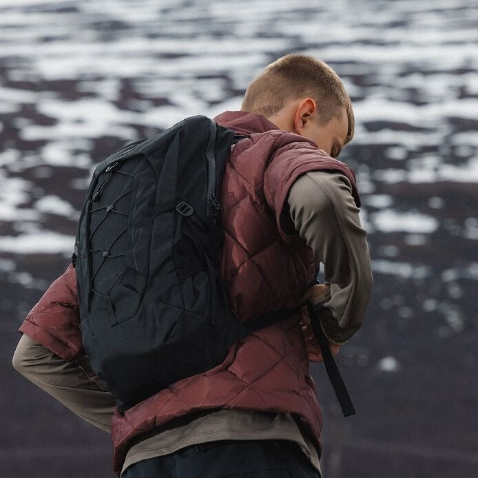 Talon™ 11 VSN^ backpack in black, worn on back with adjustable shoulder straps