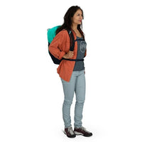 30L backpack worn by a person in orange jacket with teal backpack