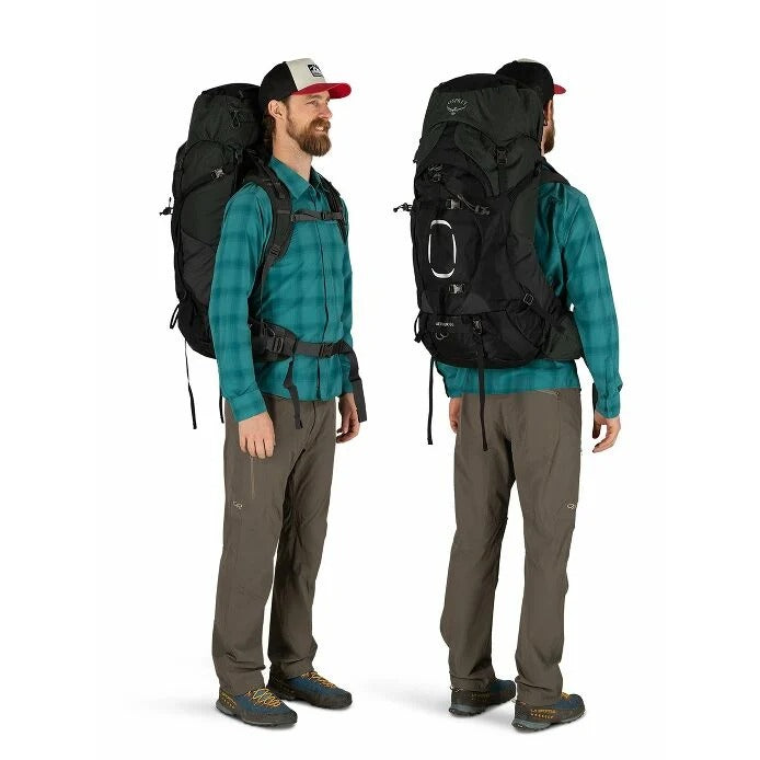 Man wearing a large black backpack from front and back views on a white background