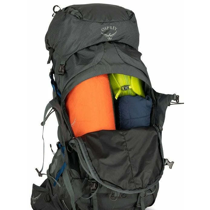Osprey backpack with colorful items inside on a white background