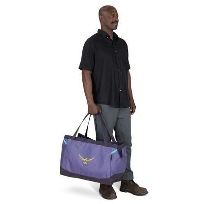 Man holding a purple bag with a logo on a white background