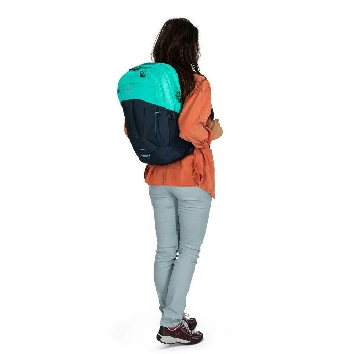 30L backpack worn by a person with teal pack and orange jacket