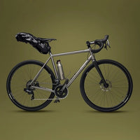 Silver bicycle on a green background