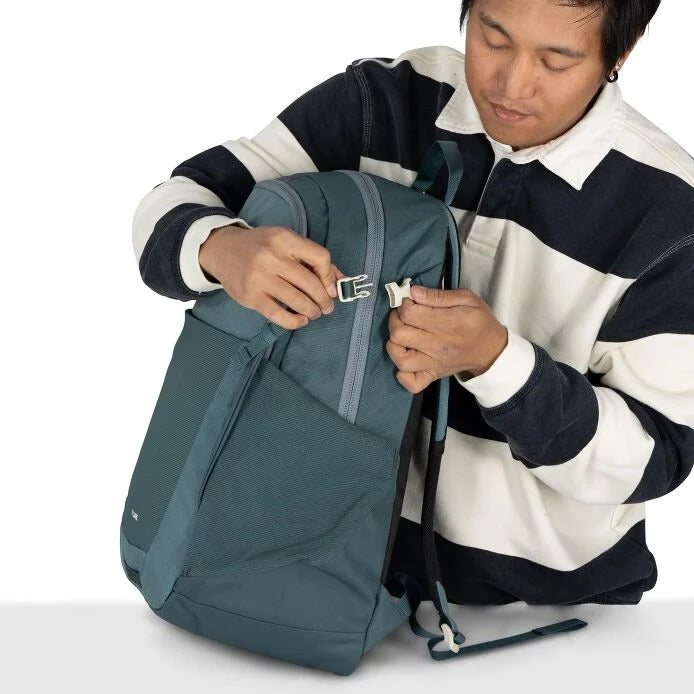 Teal daypack backpack open with front zipper, internal straps, and small hanging loop