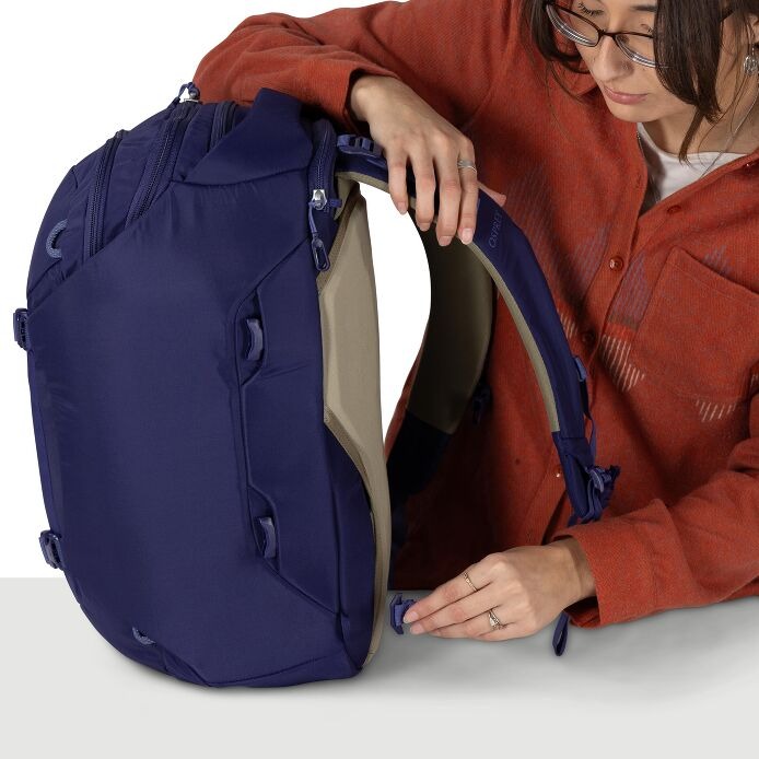 Navy travel backpack open with inner compartment and side access zipper