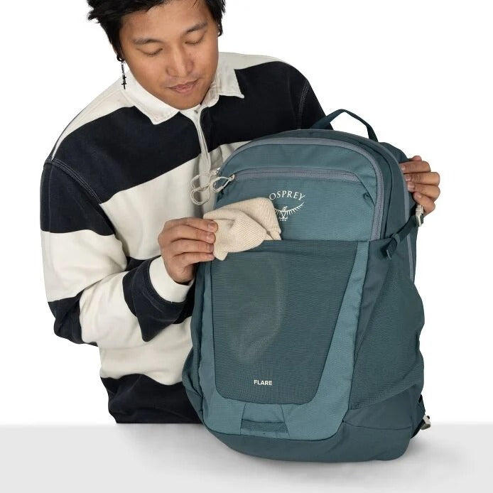Teal daypack backpack with front zip pocket and OSPREY logo badge