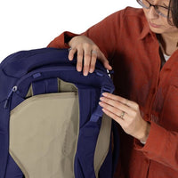 Close-up of blue travel backpack front zipper and beige inner panel
