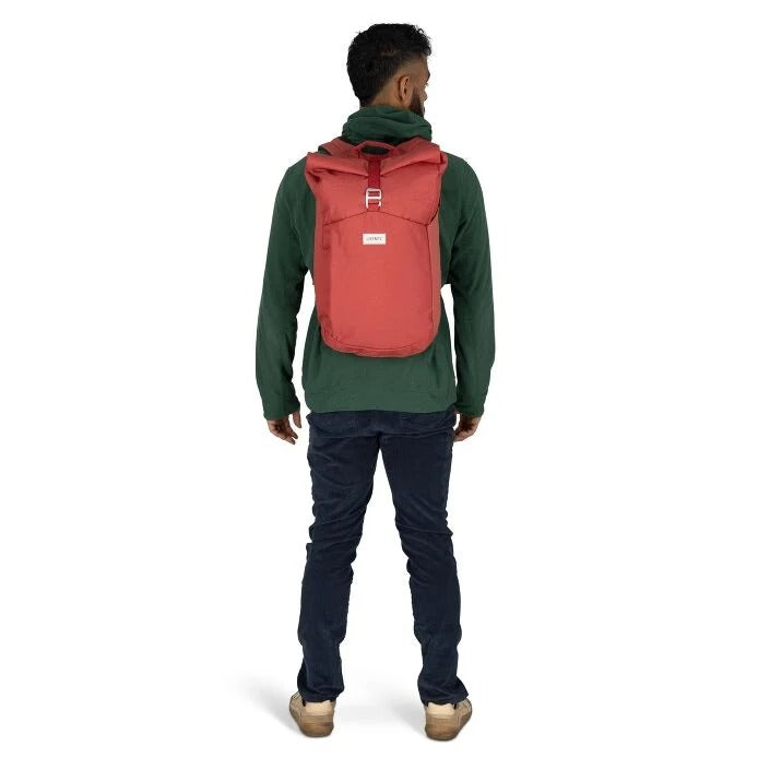 Person wearing a red backpack on a white background
