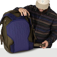 Travel pack with dark blue front flap and olive outer body, shown from the side