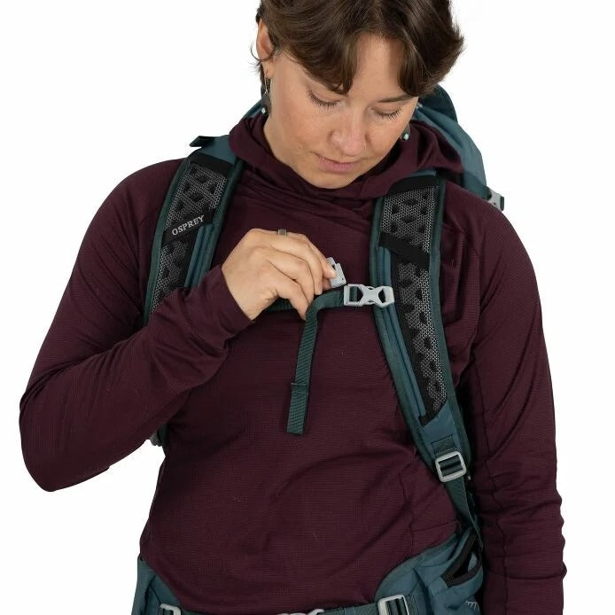 Teal hiking backpack close-up with adjustable chest strap and padded shoulder straps