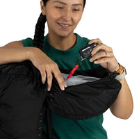 Person holding a black bag and a key fob with a white background