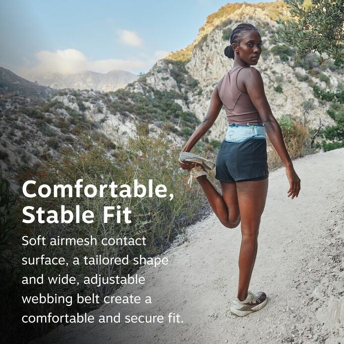 Runner wearing a stable-fit waist belt with adjustable webbing strap