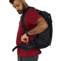Black hiking backpack with padded shoulder straps and adjustable waist belt