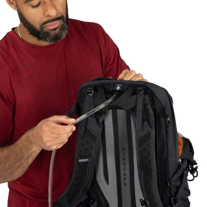 Black hiking backpack front panel with Osprey logo and adjustable straps