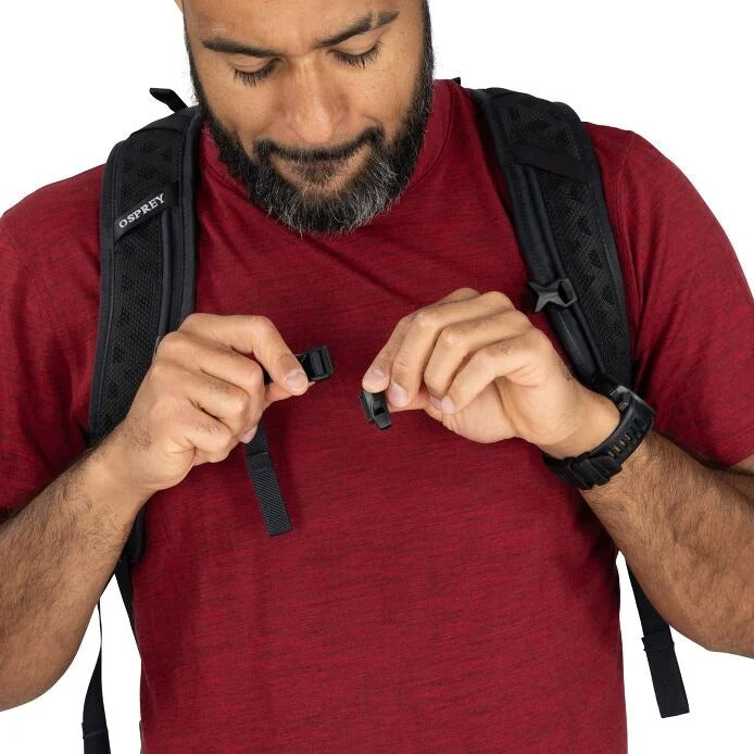 Black hiking backpack with sternum strap and adjustable webbing buckles