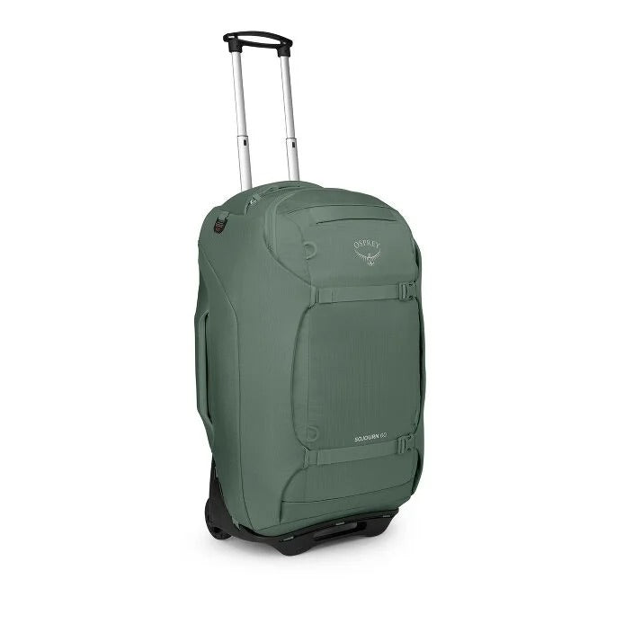 Green wheeled travel backpack with telescoping handle and front storage panel