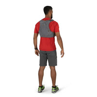 Man wearing a red shirt, gray shorts, and a gray backpack on a white background