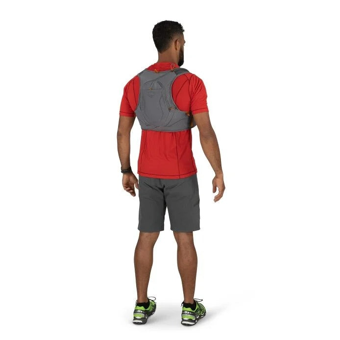Man wearing a red shirt, gray shorts, and a gray backpack on a white background