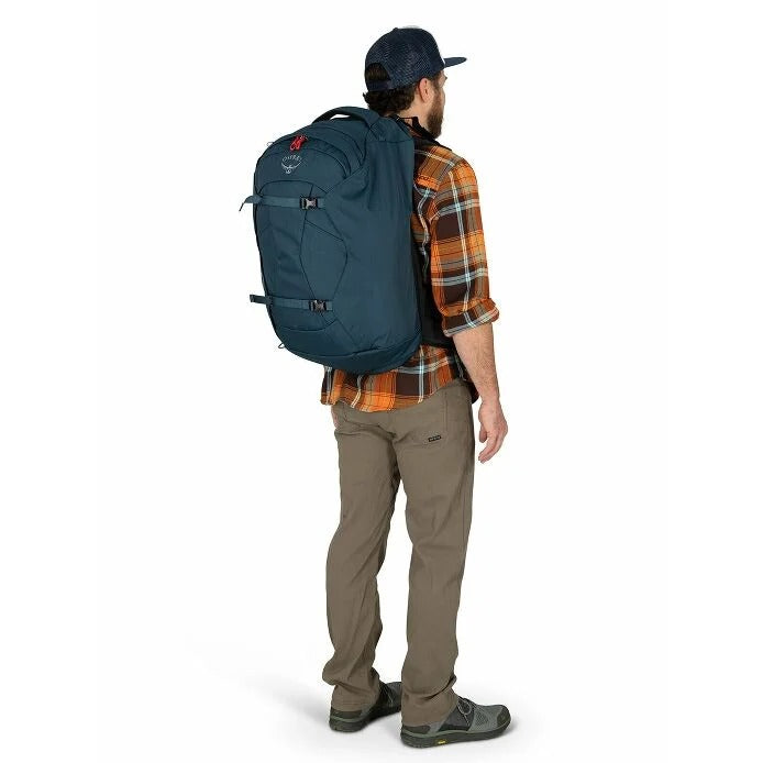 Man wearing a blue backpack on a white background