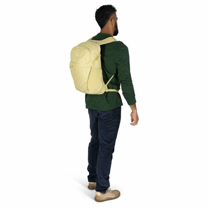 Man wearing a beige backpack on a white background