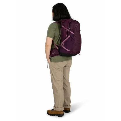 Person wearing a purple backpack on a white background