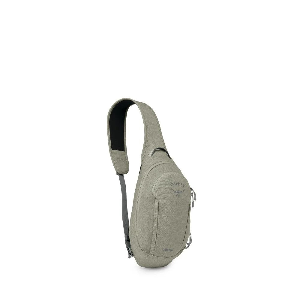 Grey sling bag with single shoulder strap, curved front pocket and small zip pull tab
