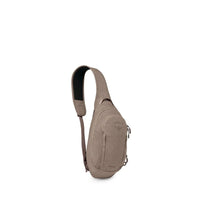 Beige sling bag with single shoulder strap, curved front pocket and small zip pull tab
