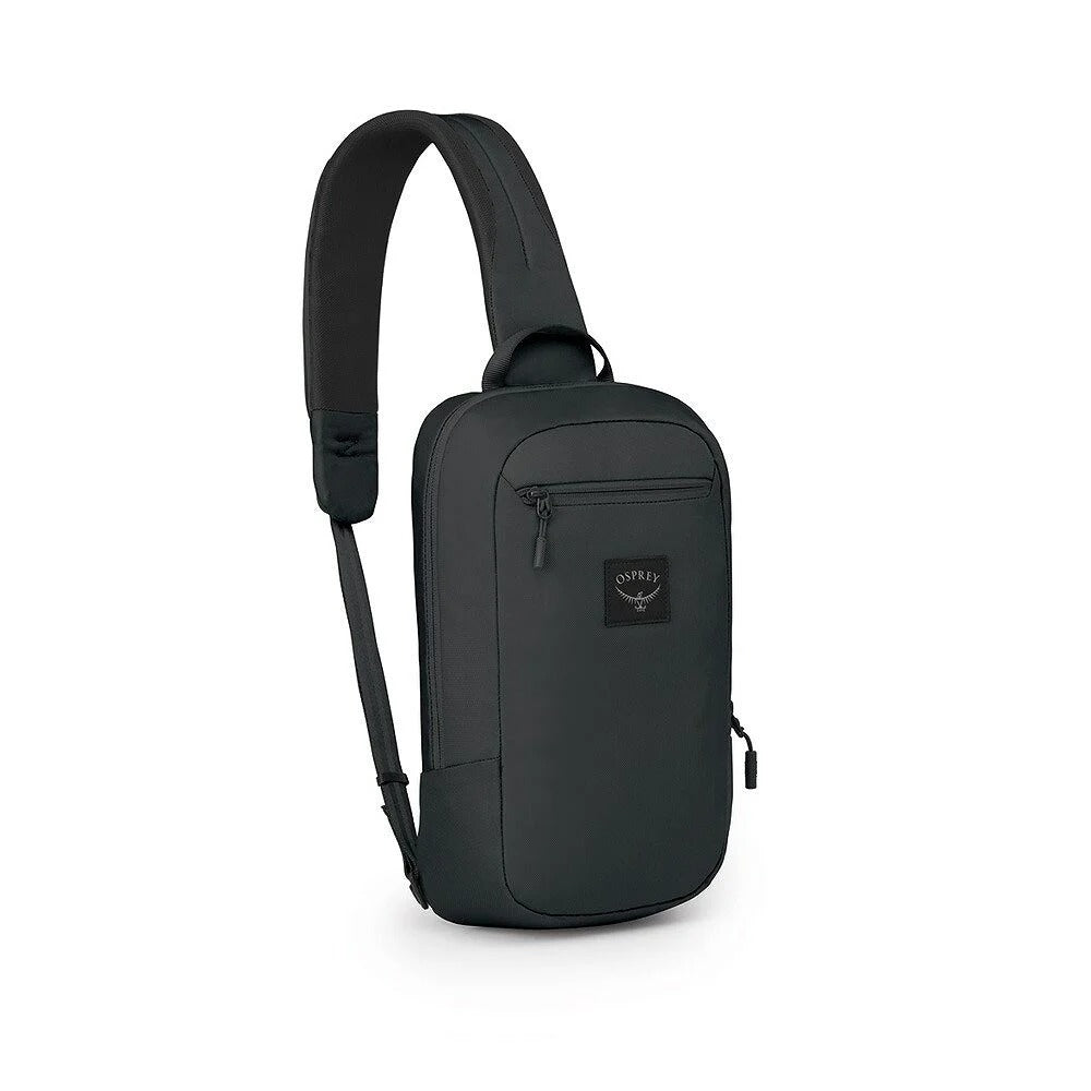 Aoede sling bag in black with front zip pocket and adjustable shoulder strap