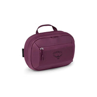 Large toiletry bag in moody burgundy with top handle, front zip pocket, and OSPREY logo.
