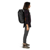 Person wearing a black backpack on a white background