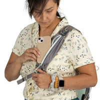 Person using a smartphone with a backpack on a white background