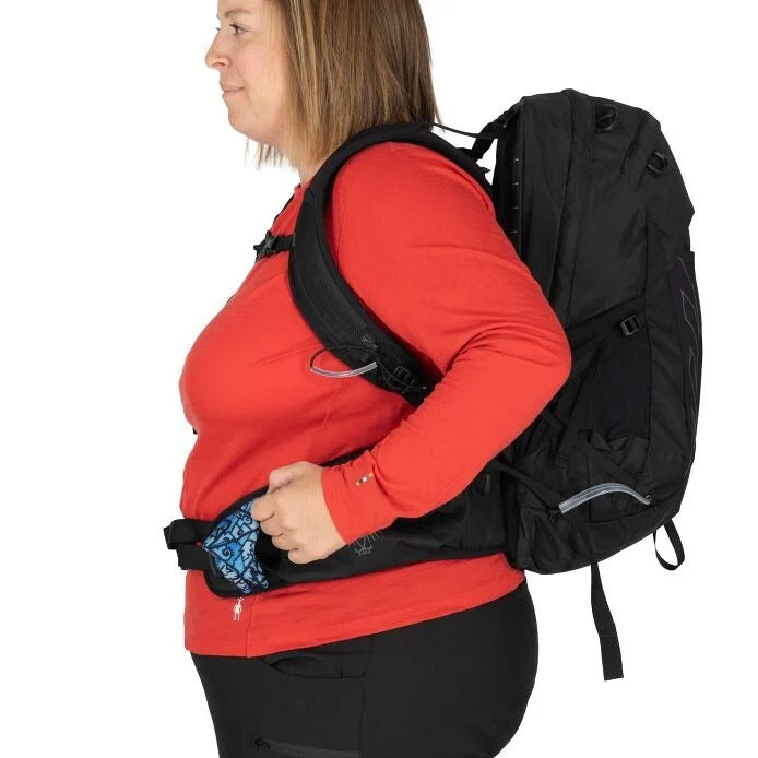 Person wearing a black backpack on a white background