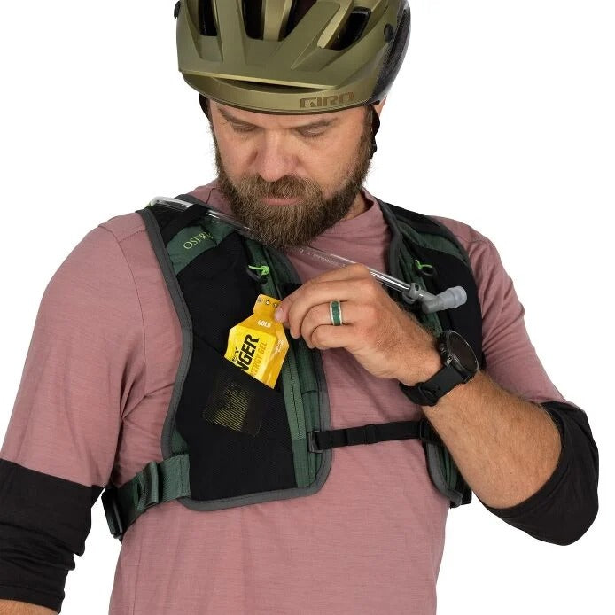 Man wearing a helmet and backpack with a yellow tool, on a white background