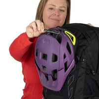 Person holding a purple helmet with a white background